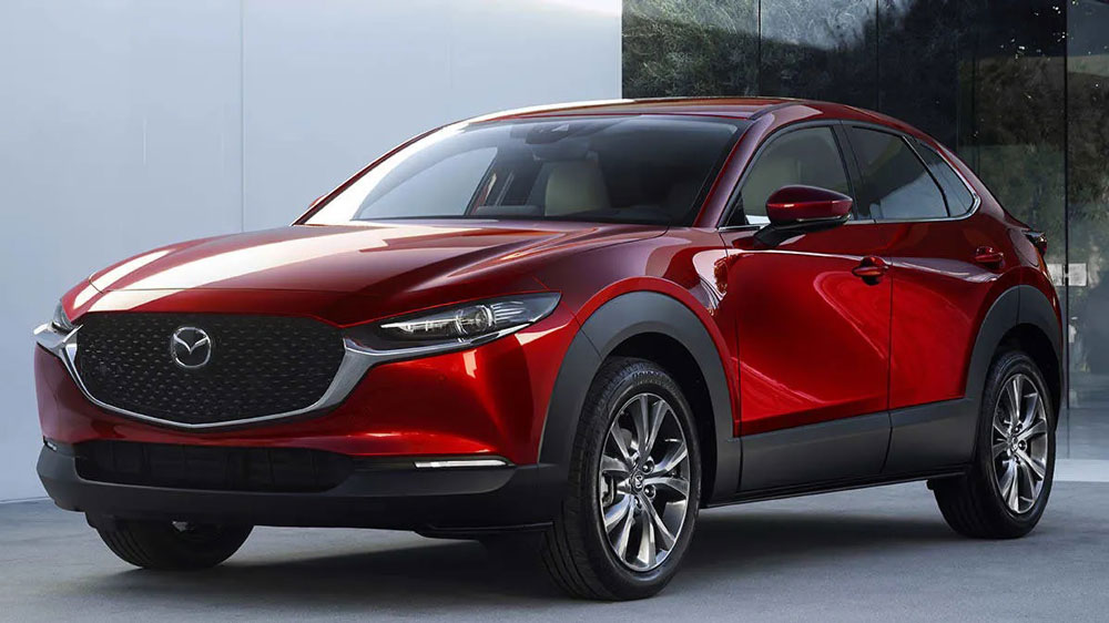 A Red Mazda CX-30 Parked Outside Showroom